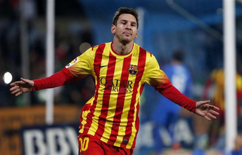 Barcelona's Lionel Messi celebrates after scoring his second goal against Getafe during their Spanish King's Cup soccer match at Colisseum A Barcelona's Lionel Messi celebrates after scoring his second goal against Getafe during their Spanish King's Cup soccer match at Colisseum A