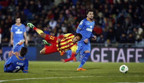 Barcelona's Neymar (C) falls as he is tackled by Getafe's Alexis Ruano (L) during their Spanish King's Cup soccer match at Colisseum Alfonso Barcelona's Neymar (C) falls as he is tackled by Getafe's Alexis Ruano (L) during their Spanish King's Cup soccer match at Colisseum Alfonso