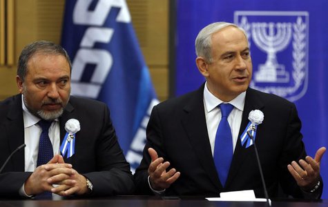 Israel's Prime Minister Benjamin Netanyahu (R) and Avigdor Lieberman attend a Likud-Beitenu faction meeting at parliament in Jerusalem Febru Israel's Prime Minister Benjamin Netanyahu (R) and Avigdor Lieberman attend a Likud-Beitenu faction meeting at parliament in Jerusalem Febru