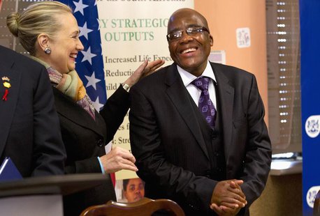 U.S. Secretary of State Hillary Clinton talks with South Africa's Health Minister Aaron Motsoaledi after attending a PEPFAR (U.S. President' U.S. Secretary of State Hillary Clinton talks with South Africa's Health Minister Aaron Motsoaledi after attending a PEPFAR (U.S. President'
