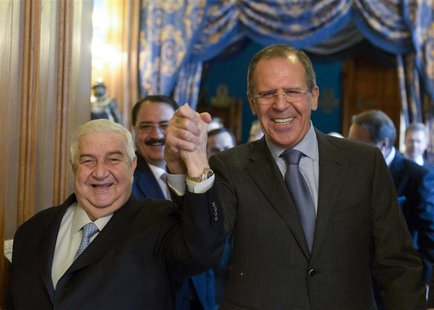Syrian Foreign Minister Walid al-Moualem (L) and his Russian counterpart Sergei Lavrov enter a hall before the talks in Moscow, January 17, Syrian Foreign Minister Walid al-Moualem (L) and his Russian counterpart Sergei Lavrov enter a hall before the talks in Moscow, January 17,