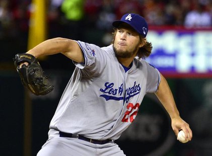 Los Angeles Dodgers starting pitcher Clayton Kershaw throws a pitch against the St. Louis Cardinals during the first inning in game six of t Los Angeles Dodgers starting pitcher Clayton Kershaw throws a pitch against the St. Louis Cardinals during the first inning in game six of t
