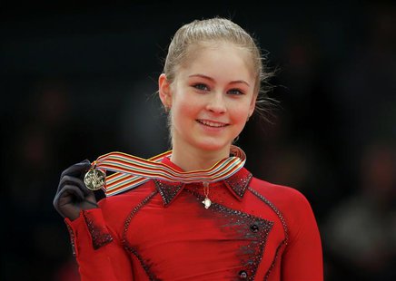 Gold medallist Julia Lipnitskaia of Russia poses during medal ceremony after the Ladies Free Skating event at the ISU European Figure Skatin Gold medallist Julia Lipnitskaia of Russia poses during medal ceremony after the Ladies Free Skating event at the ISU European Figure Skatin