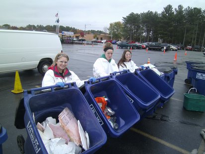 Mosinee High School Green Team members Emily Babcock (left) Hannah Hill (center) and Kortney Marshall (right) showing some of the recyclable materials removed from the garbage. Mosinee High School Green Team members Emily Babcock (left) Hannah Hill (center) and Kortney Marshall (right) showing some of the recyclable materials removed from the garbage.