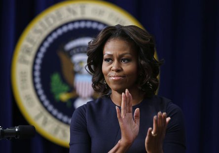 U.S. first lady Michelle Obama applauds as she gives remarks at an event on Expanding College Opportunity inside the Eisenhower Executive Of U.S. first lady Michelle Obama applauds as she gives remarks at an event on Expanding College Opportunity inside the Eisenhower Executive Of