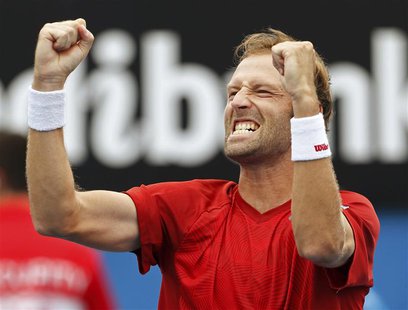 Stephane Robert of France celebrates defeating Martin Klizan of Slovakia during their men's singles match at the Australian Open 2014 tennis Stephane Robert of France celebrates defeating Martin Klizan of Slovakia during their men's singles match at the Australian Open 2014 tennis