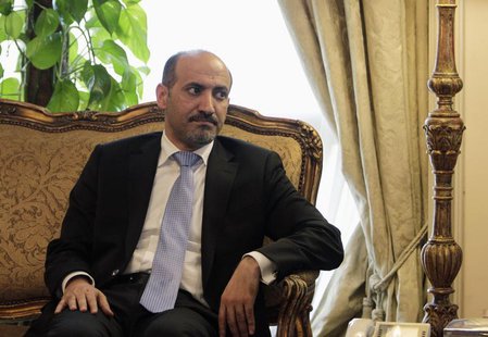 President of the Syrian National Coalition Ahmad Al-Jarba looks on during his meeting with Egypt's Foreign Minister Nabil Fahmy (not picture President of the Syrian National Coalition Ahmad Al-Jarba looks on during his meeting with Egypt's Foreign Minister Nabil Fahmy (not picture