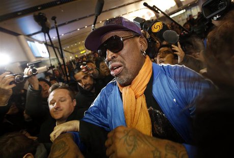 Retired U.S. basketball star Dennis Rodman is surrounded by journalists upon his arrival from North Korea's Pyongyang at Beijing Capital Int Retired U.S. basketball star Dennis Rodman is surrounded by journalists upon his arrival from North Korea's Pyongyang at Beijing Capital Int