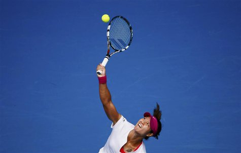 Li Na of China serves to Ekaterina Makarova of Russia during their women's singles match at the Australian Open 2014 tennis tournament in Me Li Na of China serves to Ekaterina Makarova of Russia during their women's singles match at the Australian Open 2014 tennis tournament in Me