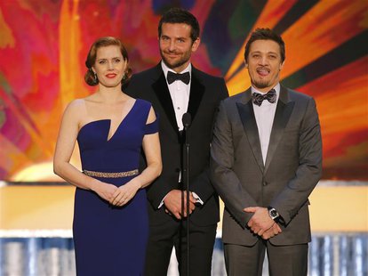 Actors Amy Adams, Bradley Cooper (C) and Jeremy Renner introduce a clip from the film "American Hustle" at the 20th annual Screen Actors Gui Actors Amy Adams, Bradley Cooper (C) and Jeremy Renner introduce a clip from the film "American Hustle" at the 20th annual Screen Actors Gui