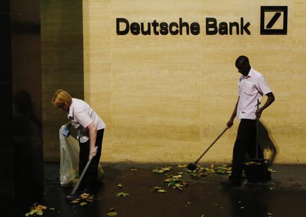 Workers sweep leaves outside Deutsche Bank offices in London December 5, 2013. REUTERS/Luke MacGregor Workers sweep leaves outside Deutsche Bank offices in London December 5, 2013. REUTERS/Luke MacGregor