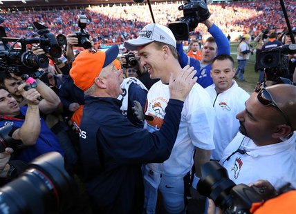 Jan 19, 2014; Denver, CO, USA; Denver Broncos head coach John Fox and quarterback Peyton Manning (18) celebrate after the 2013 AFC champions Jan 19, 2014; Denver, CO, USA; Denver Broncos head coach John Fox and quarterback Peyton Manning (18) celebrate after the 2013 AFC champions