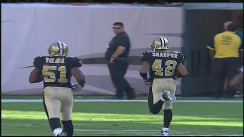 Darren Sharper returns an interception for a touchdown while a member of the New Orleans Saints. The former NFL player was arrested Friday on suspicion of rape. (Photo from: FOX 11). Darren Sharper returns an interception for a touchdown while a member of the New Orleans Saints. The former NFL player was arrested Friday on suspicion of rape. (Photo from: FOX 11).