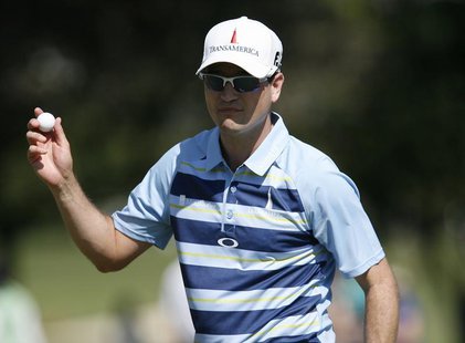 Zach Johnson of the U.S. waves to the gallery after finishing the third hole during the final round of the Sony Open golf tournament at Waia Zach Johnson of the U.S. waves to the gallery after finishing the third hole during the final round of the Sony Open golf tournament at Waia