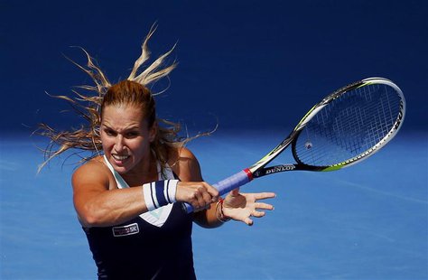 Dominika Cibulkova of Slovakia hits a return to Maria Sharapova of Russia during their women's singles match at the Australian Open 2014 ten Dominika Cibulkova of Slovakia hits a return to Maria Sharapova of Russia during their women's singles match at the Australian Open 2014 ten