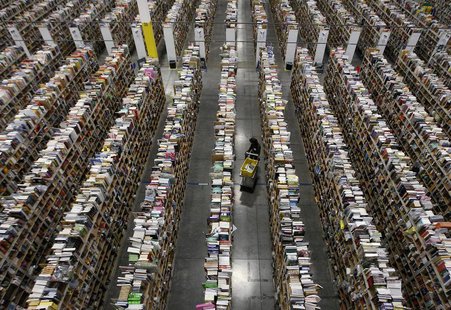 A worker gathers items for delivery from the warehouse floor at Amazon's distribution center in Phoenix, Arizona November 22, 2013. REUTERS/ A worker gathers items for delivery from the warehouse floor at Amazon's distribution center in Phoenix, Arizona November 22, 2013. REUTERS/