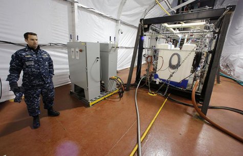 The Field Deployable Hydrolysis System used to destroy and neutralize chemical weapons is watched by U.S. Navy Commander Bill Speaks as it s The Field Deployable Hydrolysis System used to destroy and neutralize chemical weapons is watched by U.S. Navy Commander Bill Speaks as it s
