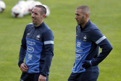 France's soccer team players Franck Ribery (L) and Karim Benzema attend a training session at Clairefontaine, near Paris, October 9, 2013. R France's soccer team players Franck Ribery (L) and Karim Benzema attend a training session at Clairefontaine, near Paris, October 9, 2013. R