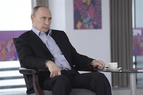 Russian President Vladimir Putin listens to a journalist's question during a televised news conference in Sochi January 19, 2014. REUTERS/Al Russian President Vladimir Putin listens to a journalist's question during a televised news conference in Sochi January 19, 2014. REUTERS/Al