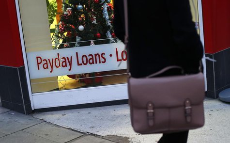 A payday loans sign is seen in the window of Speedy Cash in northwest London November 25, 2013. REUTERS/Suzanne Plunkett A payday loans sign is seen in the window of Speedy Cash in northwest London November 25, 2013. REUTERS/Suzanne Plunkett