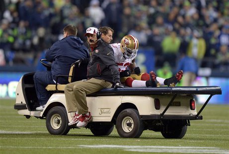 Jan 19, 2014; Seattle, WA, USA; San Francisco 49ers inside linebacker NaVorro Bowman (53) is carted off the field after an injury against th Jan 19, 2014; Seattle, WA, USA; San Francisco 49ers inside linebacker NaVorro Bowman (53) is carted off the field after an injury against th