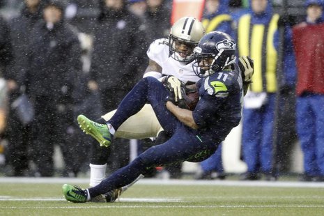 Jan 11, 2014; Seattle, WA, USA; Seattle Seahawks wide receiver Percy Harvin (11) catches a pass against New Orleans Saints cornerback Corey Jan 11, 2014; Seattle, WA, USA; Seattle Seahawks wide receiver Percy Harvin (11) catches a pass against New Orleans Saints cornerback Corey