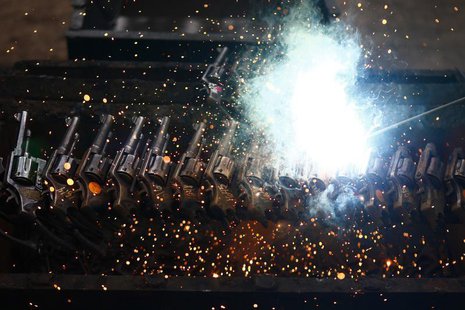 A batch of confiscated guns by national security authorities are destroyed at a military zone of Mexico City April 17, 2013. REUTERS/Edgard A batch of confiscated guns by national security authorities are destroyed at a military zone of Mexico City April 17, 2013. REUTERS/Edgard