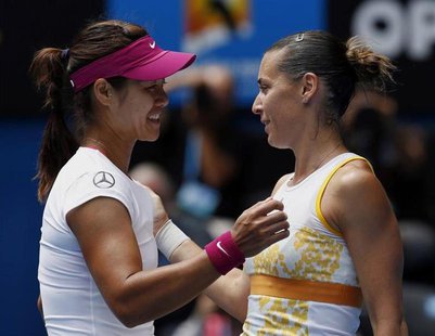 Li Na (L) of China shakes hands with Flavia Pennetta of Italy after winning their women's singles quarter-final match at the Australian Open Li Na (L) of China shakes hands with Flavia Pennetta of Italy after winning their women's singles quarter-final match at the Australian Open