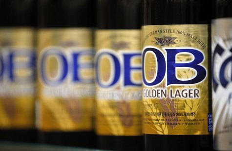 Bottled beers produced by South Korea's Oriental Brewery Co are displayed at the liquor section of a market in Seoul January 20, 2014. REUTE Bottled beers produced by South Korea's Oriental Brewery Co are displayed at the liquor section of a market in Seoul January 20, 2014. REUTE