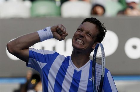 Tomas Berdych of the Czech Republic celebrates defeating David Ferrer of Spain in their men's singles quarter-final tennis match at the Aust Tomas Berdych of the Czech Republic celebrates defeating David Ferrer of Spain in their men's singles quarter-final tennis match at the Aust