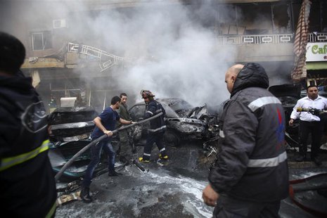 Firefighters extinguish a fire at the site of an explosion in the Haret Hreik area, in the southern suburbs of the Lebanese capital Beirut J Firefighters extinguish a fire at the site of an explosion in the Haret Hreik area, in the southern suburbs of the Lebanese capital Beirut J