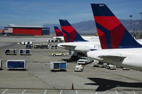 Delta planes line up at their gates while on the tarmac of Salt Lake City International Airport in Utah September 28, 2013. Picture taken Se Delta planes line up at their gates while on the tarmac of Salt Lake City International Airport in Utah September 28, 2013. Picture taken Se