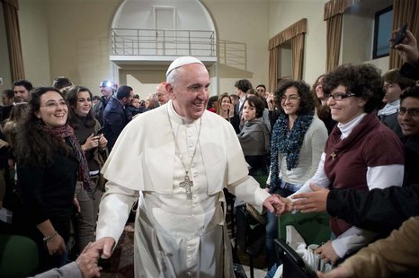 Pope Francis (C) is greeted during a pastoral visit at the Sacro Cuore Basilica in downtown Rome January 19, 2014. REUTERS/Osservatore Roman Pope Francis (C) is greeted during a pastoral visit at the Sacro Cuore Basilica in downtown Rome January 19, 2014. REUTERS/Osservatore Roman