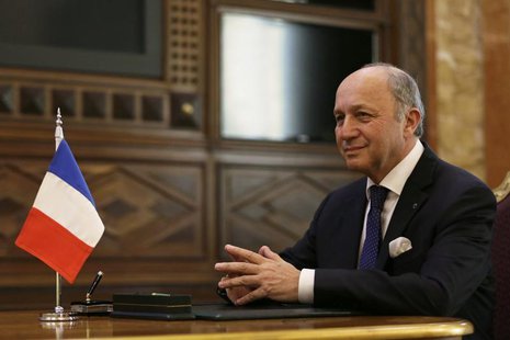 French Foreign Affairs Minister Laurent Fabius signs a contract during a meeting at the Saudi Royal palace, in Riyadh December 29, 2013. REU French Foreign Affairs Minister Laurent Fabius signs a contract during a meeting at the Saudi Royal palace, in Riyadh December 29, 2013. REU