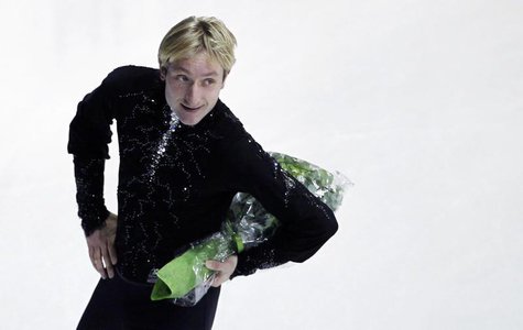 Russia's Evgeni Plushenko holds a bouquet of flowers after his performance in the men's short program at the European Figure Skating Champio Russia's Evgeni Plushenko holds a bouquet of flowers after his performance in the men's short program at the European Figure Skating Champio