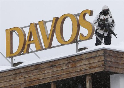 A Swiss special policeman patrols on a roof before the start of the annual meeting of the World Economic Forum (WEF) 2014 in Davos January 2 A Swiss special policeman patrols on a roof before the start of the annual meeting of the World Economic Forum (WEF) 2014 in Davos January 2