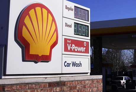 The Shell logo sign is seen at one of its gas station next to the current fuel prices display in Westminster, Colorado January 17, 2014. REU The Shell logo sign is seen at one of its gas station next to the current fuel prices display in Westminster, Colorado January 17, 2014. REU