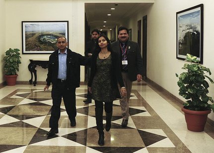 Indian diplomat Devyani Khobragade (C) arrives with her father Uttam Khobragade (L) at Maharashtra Sadan state guesthouse in New Delhi Janua Indian diplomat Devyani Khobragade (C) arrives with her father Uttam Khobragade (L) at Maharashtra Sadan state guesthouse in New Delhi Janua
