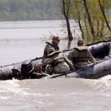 National guard members on patrol during 2011 flooding on the Missouri River in Bismarck National guard members on patrol during 2011 flooding on the Missouri River in Bismarck