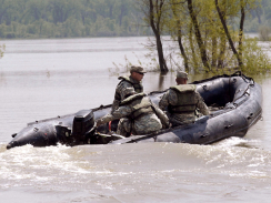 National guard members on patrol during 2011 flooding on the Missouri River in Bismarck National guard members on patrol during 2011 flooding on the Missouri River in Bismarck