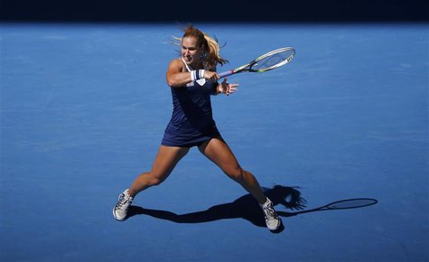 Dominika Cibulkova of Slovakia hits a return to Simona Halep of Romania during their women's singles quarter-final tennis match at the Austr Dominika Cibulkova of Slovakia hits a return to Simona Halep of Romania during their women's singles quarter-final tennis match at the Austr