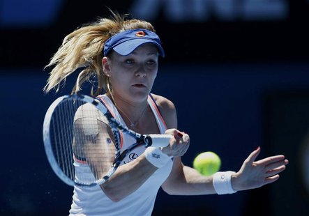 Agnieszka Radwanska of Poland hits a return to Victoria Azarenka of Belarus during their women's singles quarter-final tennis match at the A Agnieszka Radwanska of Poland hits a return to Victoria Azarenka of Belarus during their women's singles quarter-final tennis match at the A