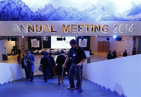 A member of staff cleans a stair inside the congress center before the start of the annual meeting of the World Economic Forum (WEF) 2014 in A member of staff cleans a stair inside the congress center before the start of the annual meeting of the World Economic Forum (WEF) 2014 in
