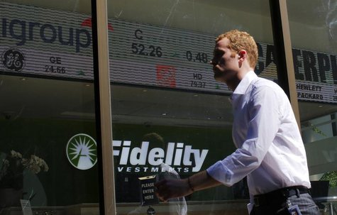 A pedestrian walks past a stock ticker at a Fidelity Investments office in Boston, Massachusetts July 31, 2013. REUTERS/Brian Snyder A pedestrian walks past a stock ticker at a Fidelity Investments office in Boston, Massachusetts July 31, 2013. REUTERS/Brian Snyder