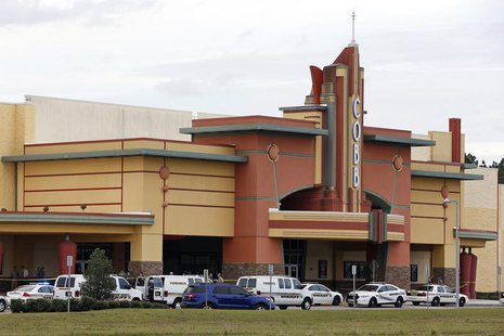 Law enforcement vehicles are parked outside the Cobb Grove 16 movie theater in Wesley Chapel, Florida January 13, 2014. REUTERS/Mike Carlson Law enforcement vehicles are parked outside the Cobb Grove 16 movie theater in Wesley Chapel, Florida January 13, 2014. REUTERS/Mike Carlson