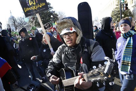 Anti-abortion demonstrators sing as they parade past the U.S. Capitol during the annual March for Life in Washington, January 22, 2014. REUT Anti-abortion demonstrators sing as they parade past the U.S. Capitol during the annual March for Life in Washington, January 22, 2014. REUT