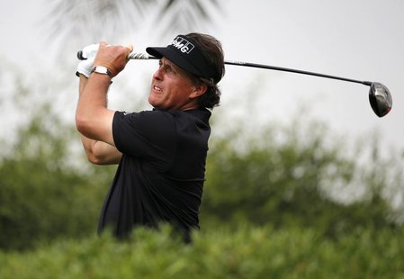 Phil Mickelson of the U.S. tees off on the 11th hole during Abu Dhabi Golf championship January 19, 2014. REUTERS/Ahmed Jadallah Phil Mickelson of the U.S. tees off on the 11th hole during Abu Dhabi Golf championship January 19, 2014. REUTERS/Ahmed Jadallah
