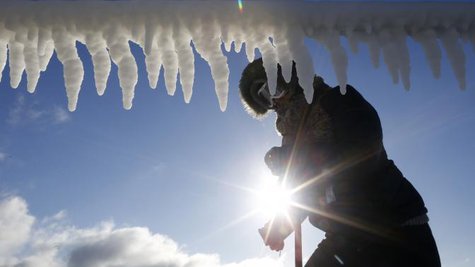 A woman is seen by icicles hanging from a breakwater along a beach in Chicago, Illinois, January 21, 2014.
CREDIT: REUTERS/JIM YOUNG A woman is seen by icicles hanging from a breakwater along a beach in Chicago, Illinois, January 21, 2014.
CREDIT: REUTERS/JIM YOUNG