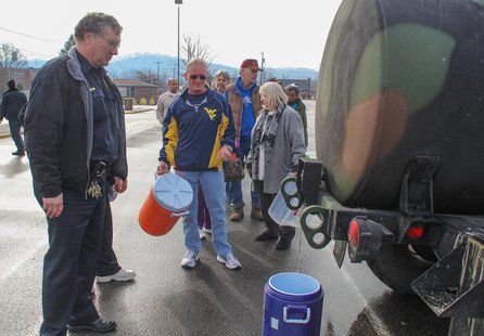 Residents line up for water at a water filling station at West Virginia State University, in Institute, West Virginia, January 10, 2014. REU Residents line up for water at a water filling station at West Virginia State University, in Institute, West Virginia, January 10, 2014. REU