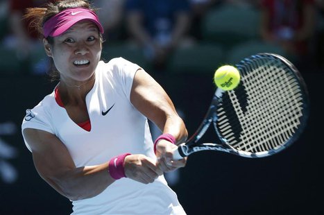 Li Na of China hits a return to Eugenie Bouchard of Canada during their women's singles semi-final match at the Australian Open 2014 tennis Li Na of China hits a return to Eugenie Bouchard of Canada during their women's singles semi-final match at the Australian Open 2014 tennis